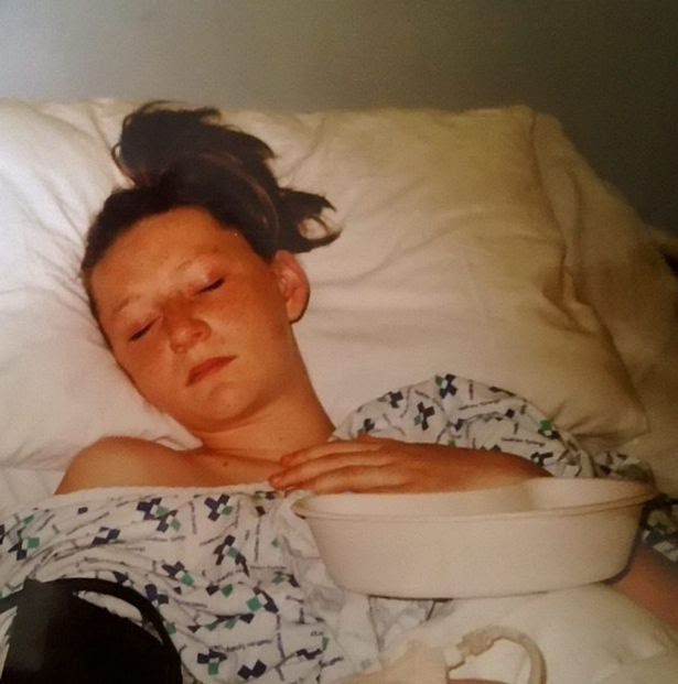 Sophie in hospital after an operation to fix her second womb