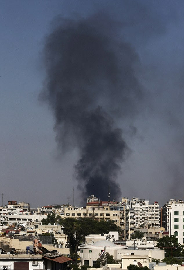 Ongoing conflict: Black columns of smoke rise after heavy shelling in the Jobar neighborhood, east of Damascus, Syria, today 