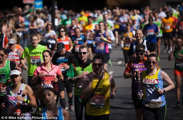 During exercise, athletes pace themselves based on how long or how hard they know they'll need to work to complete the course. It is thought the brain monitors these output levels and will limit how hard the athlete is allowed to push, to prevent injury. Stock image of the 2014 London marathon is pictured