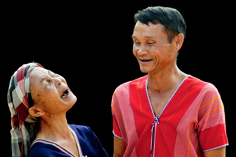 Pwo Karen couple isolated on a dark background enjoying a laugh together - 5 Key Elements that Directly Impact the Quality of Your Photography