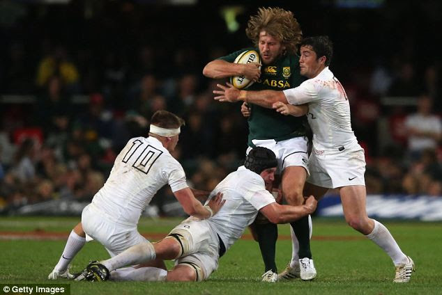 Surrounded: Frans Steyn is tackled by Owen Farrell (L), Ben Morgan and Brad Barritt (R)
