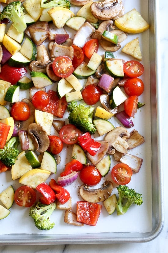 One bite of this Balsamic Roasted Veggie and White Bean Pasta and you'll want to make it all summer long! It's LOADED with veggies in every bite and finished with pesto and white beans. Roasted zucchini, yellow squash, zucchini, cherry tomatoes, red onion, mushrooms, peppers, and broccoli – SO good, and picky husband approved!
