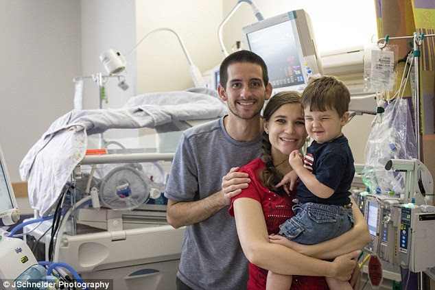 Her parents Robin and Joel and her brother Elijah, two, after the birth