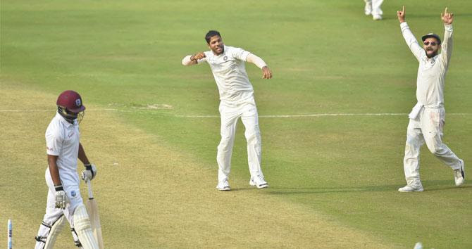 Indian bowler Umesh Yadav exults after dismissing West Indies' Shannon Gabriel on Day 3 of the second cricket Test match, in Hyderabad, on Sunday