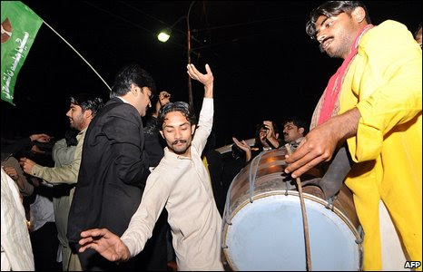 Supporters of former prime minister Nawaz Sharif dance in the streets of Gujrawala, Pakistan