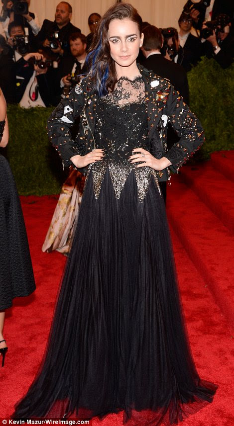 Scandalous: Lily Collins (L), who wore Moschino, and Kerry Washington, who wore Vera Wang, did punk proud