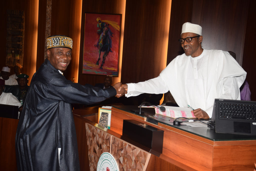 L-R; President Muhammadu Buhari Congratulating  the Newly Appointed Minister of Transport, Rotimi Amaechi after his Swearing-in ceremony at the Presidential Villa Abuja  on Wednesday