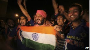 Indian fans celebrate the victory of their team over Australia in  the ICC Cricket World Cup quarter-final match, in Kolkata, India,  Thursday, March 24, 2011