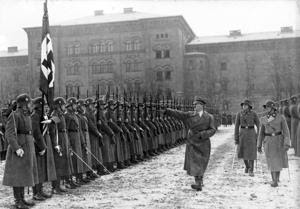 Nazi Re-enactors: A photo from the German government's national archives shows Adolf Hitler reviewing the SS Leibstandarte A.H. combat unit in December 1935. A re-enactor group's portrayal of the unit drew the ire of one U.S. military veteran, and has caused the Fairfax County Park Authority to scrap the World War II re-enactment planned for Sully Historic Site in 2016. - o.Ang.