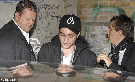 A bit tired: Robert looked weary as he got into his awaiting car to leave the club