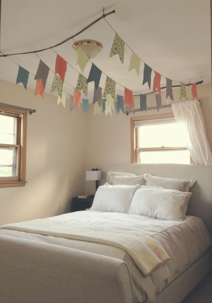 DIY flag canopy over bed. use branches to hang from the ceiling with ...