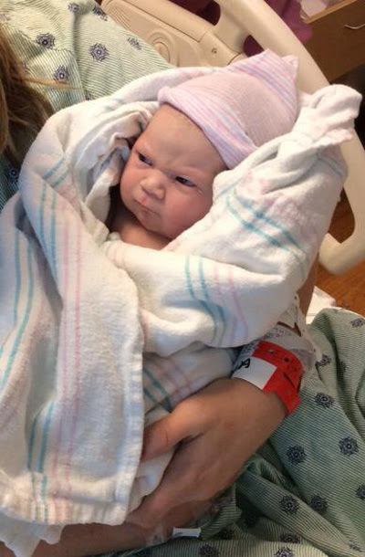 Introducing my daughter, 1 minute old and full of grump