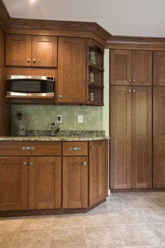 chestnut cabinets  light colored tile floors