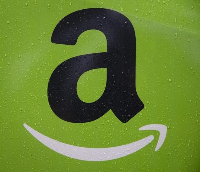 The Amazon.com, Inc. logo is seen on the side of a delivery truck in Brooklyn, New York October 23, 2014. REUTERS/Brendan McDermid