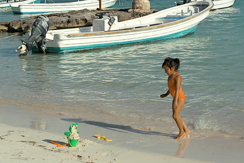  little girl playing in water at Akumal Beach, Mayan Riviera, Mexico 