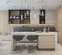 White and concrete-effect pendant lights use their playful color variation to tie the kitchen's greyscale theme together.