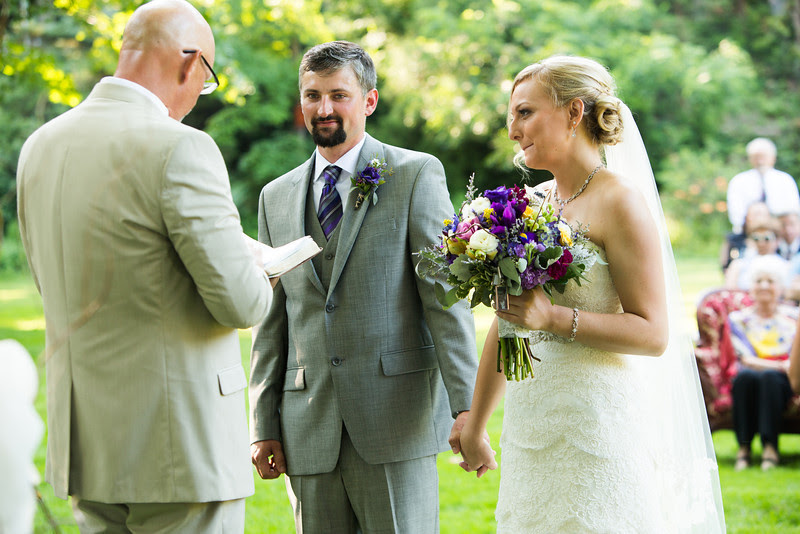 outdoor summer tent wedding reception in Rockford, Illinois. Wedding photographer – Ryan Davis Photography.