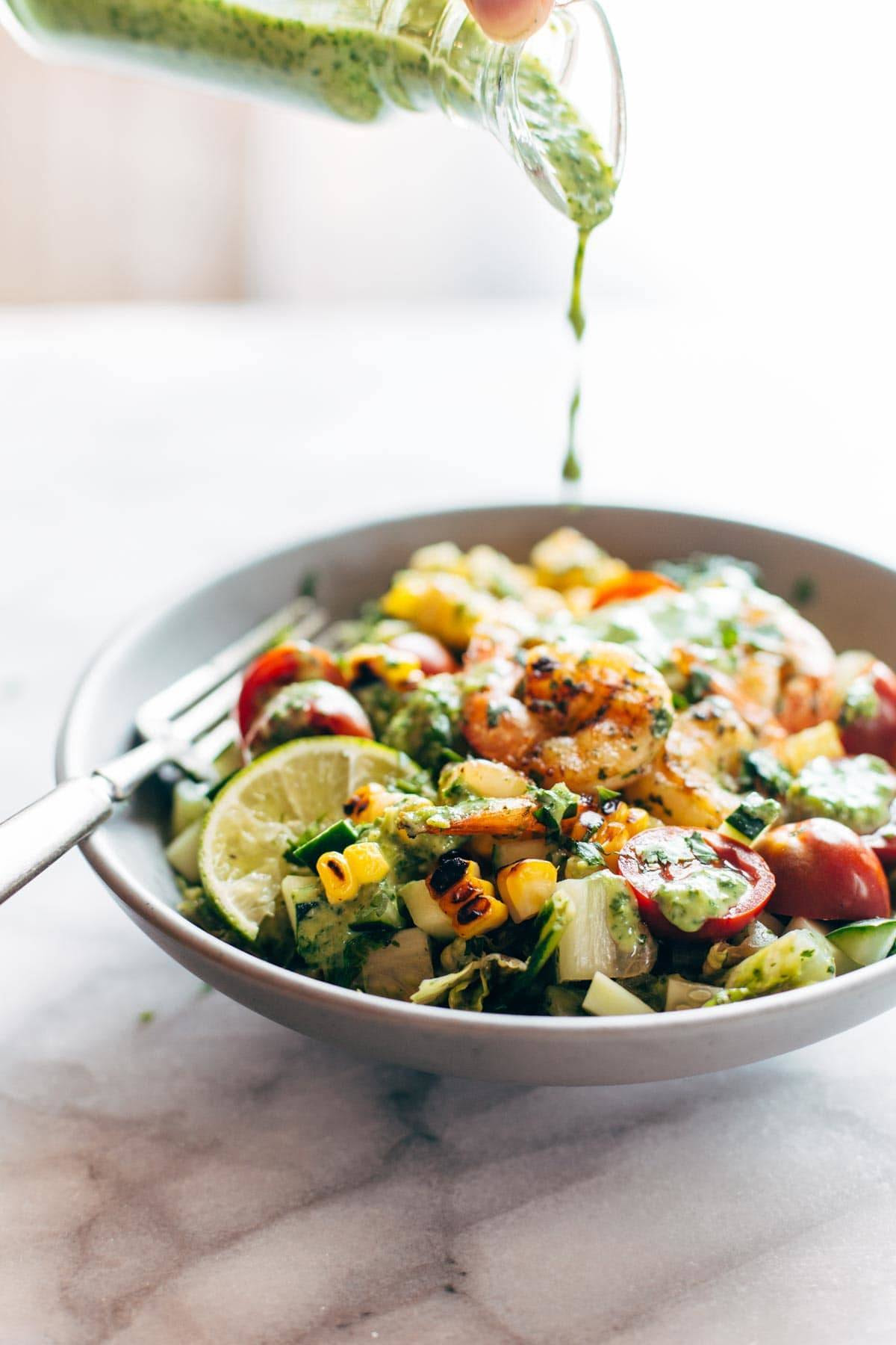 Glowing Grilled Summer Detox Salad! with grilled romaine, lime, tomato, cucumber, avocado, corn, shrimp, and cilantro dressing. | pinchofyum.com