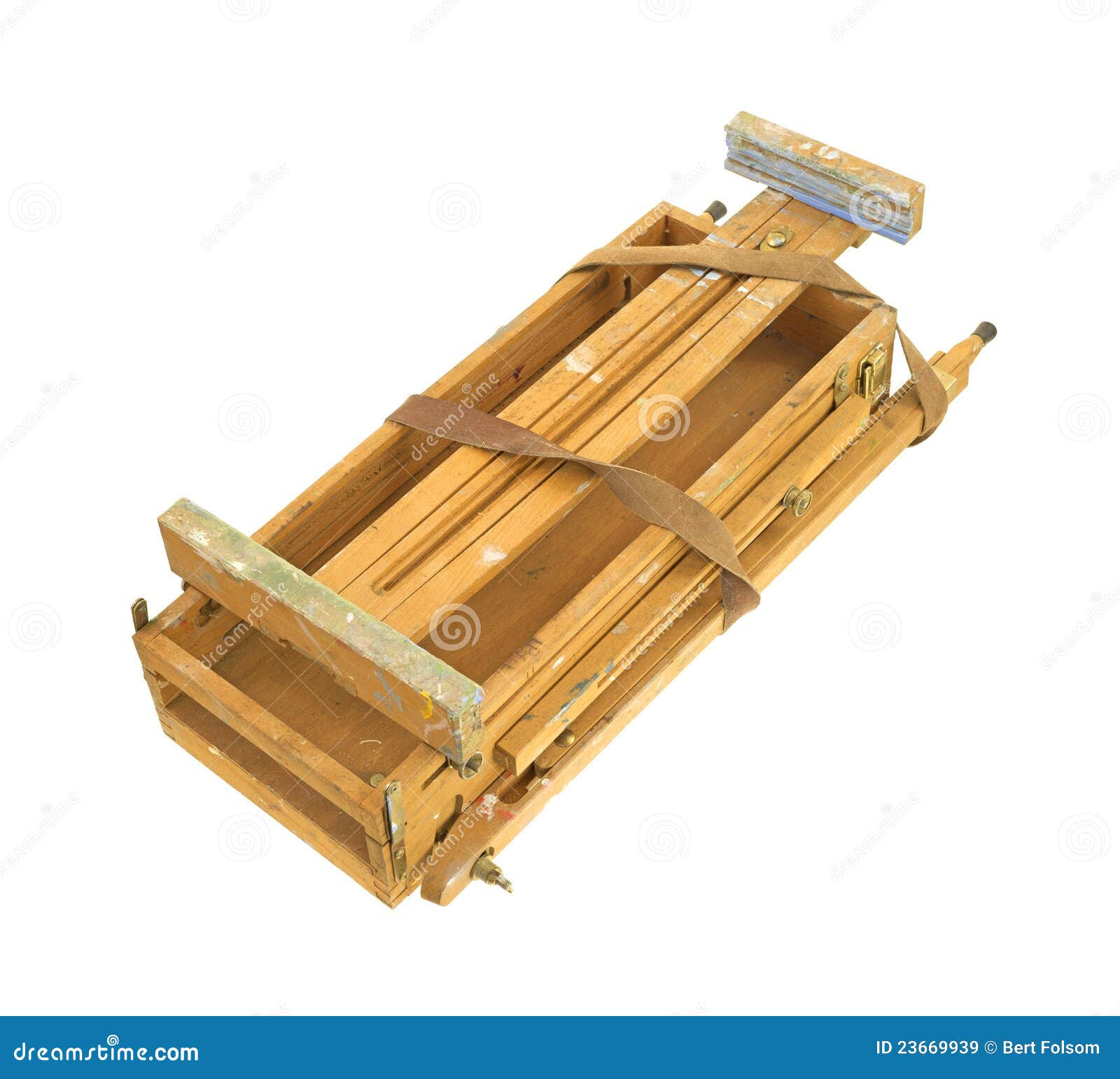 worn artist easel that is collapsed for travel on a white background 