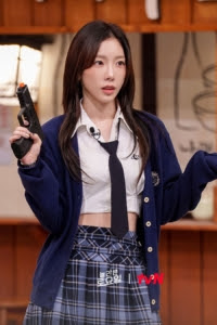Taeyeon wearing Ferragamo Elliptical Diamond Watch, Glowny Indigo Check Mini Skirt, Avandress Ailey Crop Short Sleeve Shirt and Nyhavn Candice V-Neck Cardigan