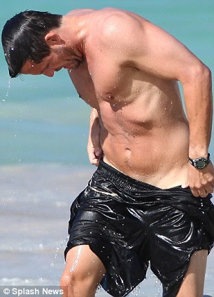 Friends: Courteney is holidaying on the Caribbean island with her Cougar Town co-star Josh Hopkins, who almost lost his shorts in the sea too 