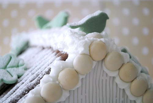 Birds perched on gingerbread roof