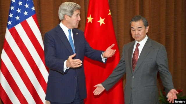 Chinese Foreign Minister Wang Yi (right) meets with U.S. Secretary of State John Kerry in Beijing on April 13.