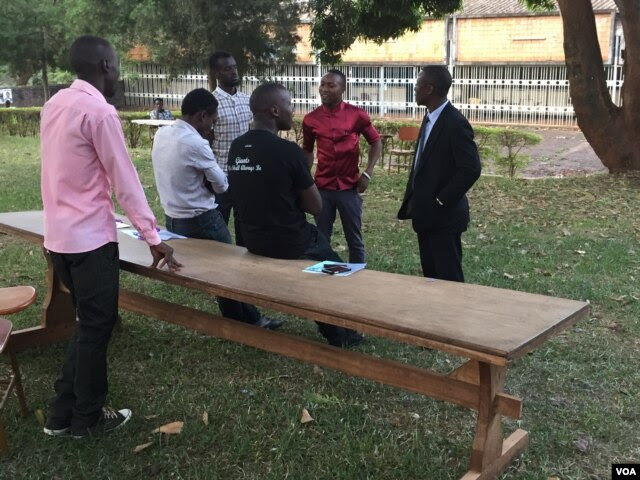 As of 7:30 am there had still been no ballots delivered to this polling station at Makerere University, Feb. 18, 2016. (J. Craig/VOA)