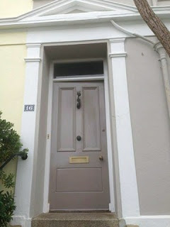 Front door is Farrow and Ball Charleston Gray with Elephants Breath house exterior walls.