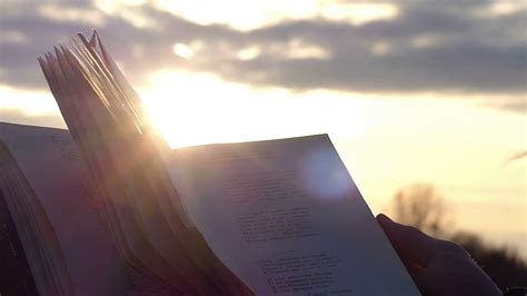 hands hold  open book  poems   background