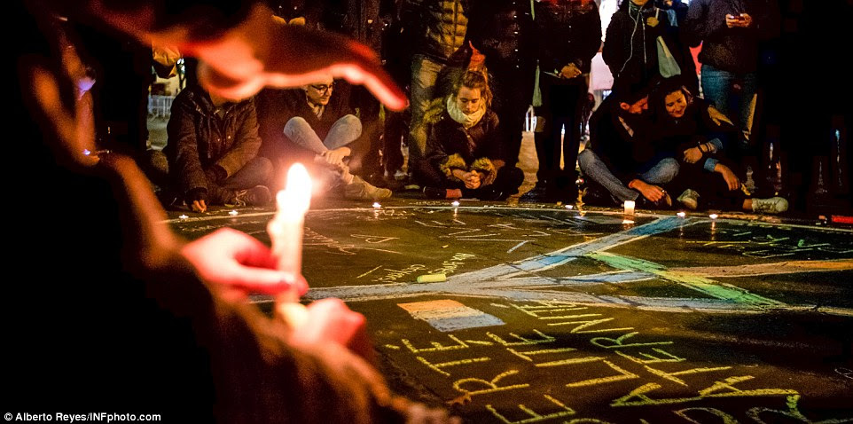 In New York, people sat in pensive silence, or hugged one another as they tried to come to terms with last night's attacks