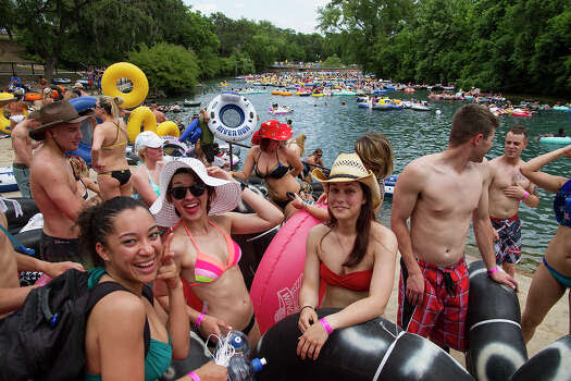 (Left to right) Tysha Lopez, Amber Perez and Kathryn Horvatitz ready for tubing on the Comal River in Prince Solms Park, Sunday, May 25, 2014 in celebration of Memorial Day. Lopez and Perez are in the Navy and Horvatitz is in the Air Force. Photo: Alma E. Hernandez,  For The Express-News