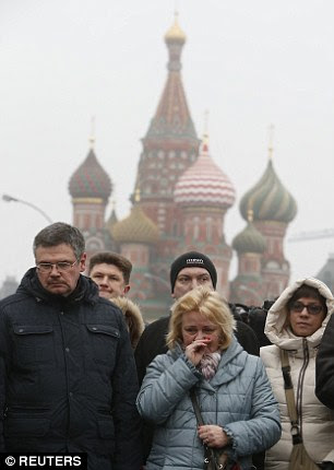 Mourners line the bridge in central Moscow where the charismatic politician was killed