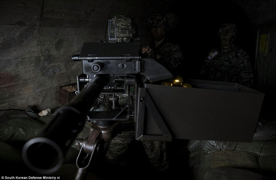 Japanese Prime Minister Shinzo Abe and his South Korean counterpart on Thursday struggled to grind down Russian resistance to new sanctions on Pyongyang over its nuclear test. Pictured above, a South Korean marine takes part in a military exercise on Wednesday