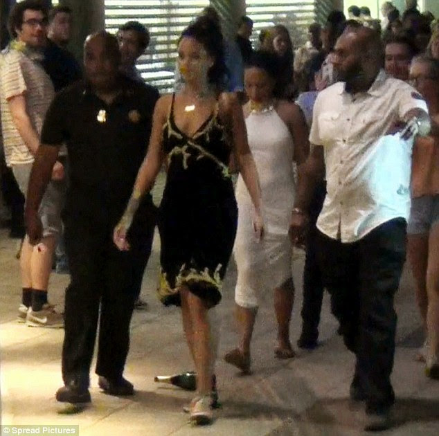 More toned down? She chose a modest black and gold dress for the star-studded bash