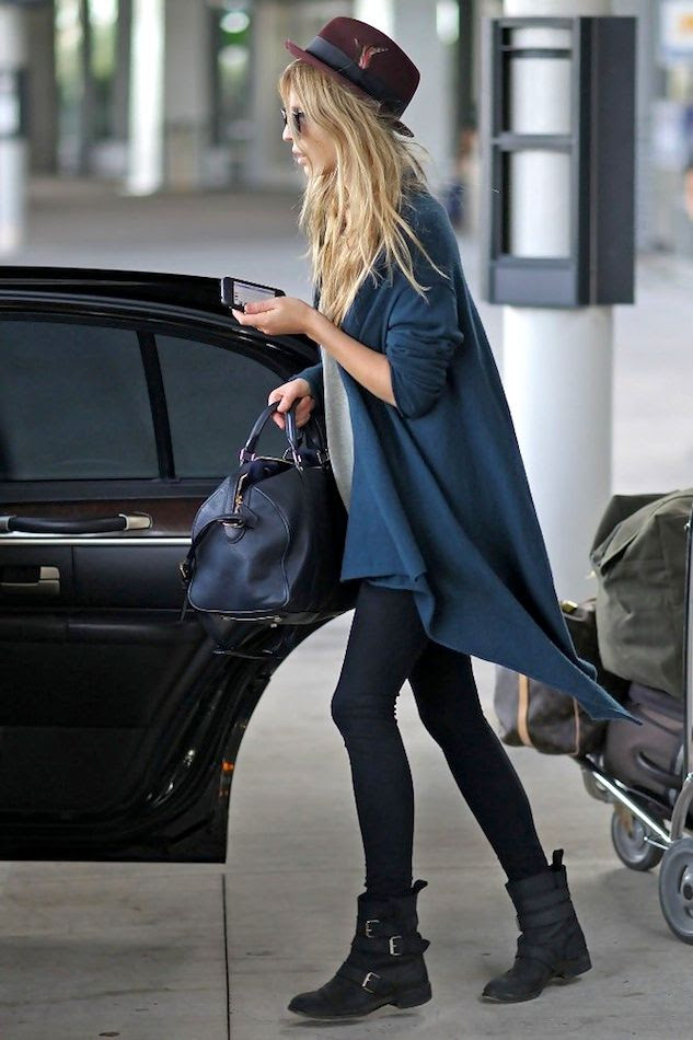 Le Fashion Blog -- Airport Look: Clemence Poesy -- Parisian Casual In A Feather Red Hat, Teal Blue Draped Cardigan, Duffle Satchel Bag, Leggings & Buckle Moto Boots -- photo Le-Fashion-Blog-Airport-Look-Clemence-Poesy-Parisian-Casual-Feather-Red-Hat-Drape-Cardigan-Leggings-Buckle-Moto-Boots.jpg