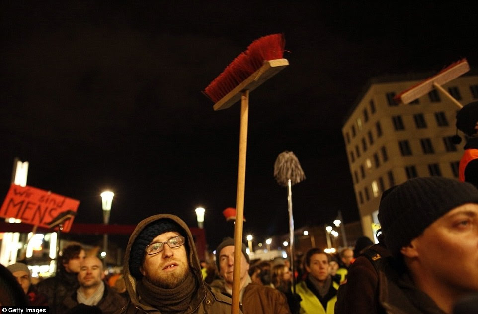 Counter-protest: A few thousands people gathered against Pegida in Dresden, some holding brooms in a symbol to 'cleanse' the city