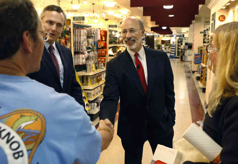 Tom Wolf, who leads in polls for Pennsylvania's Democratic gubernatorial nomination, shakes hands with a customer at a Mt. Lebanon, Pa., hardware store on Thursday.