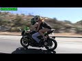 Видео A Sexy Girl in black tank top riding on a Sportbike on the freeway