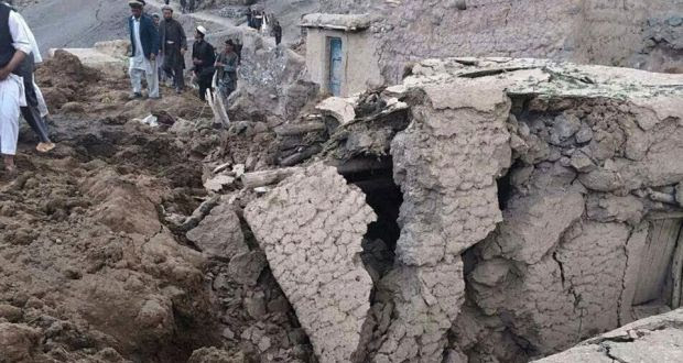 Afghan villagers gather at the site of a landslide at the Argo district in Badakhshan province yesterday. Photograph: Reuters