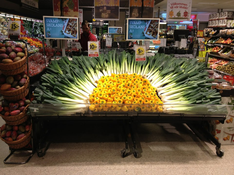 artistic Swedish grocery store display of vegetables