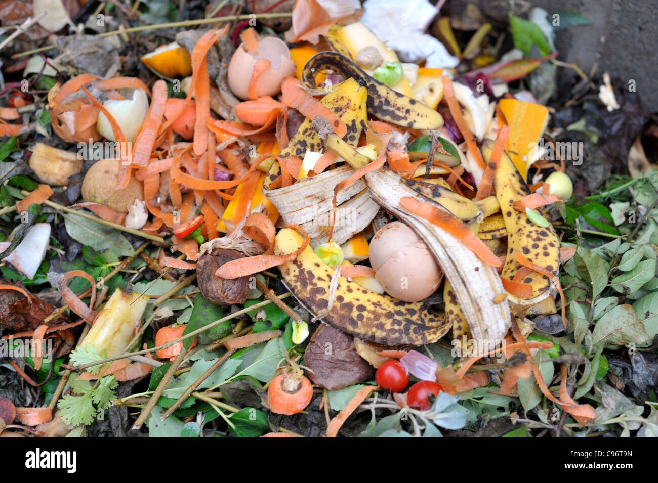 Garden Compost Heap With Plant Material And Kitchen Waste Stock