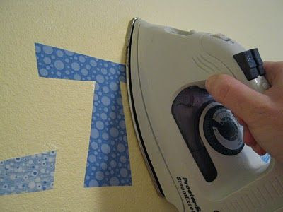 Didn't know you could iron fabric onto the wall? Just as easy as vinyl! Peels right off.... Say what?!?