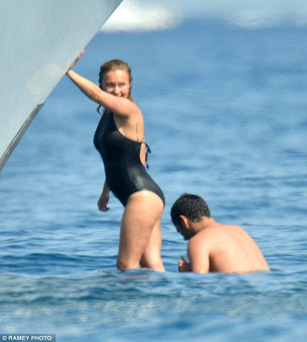 Taking a break: The newly pregnant 24-year-old looked to enjoying herself as she splashed in the sea