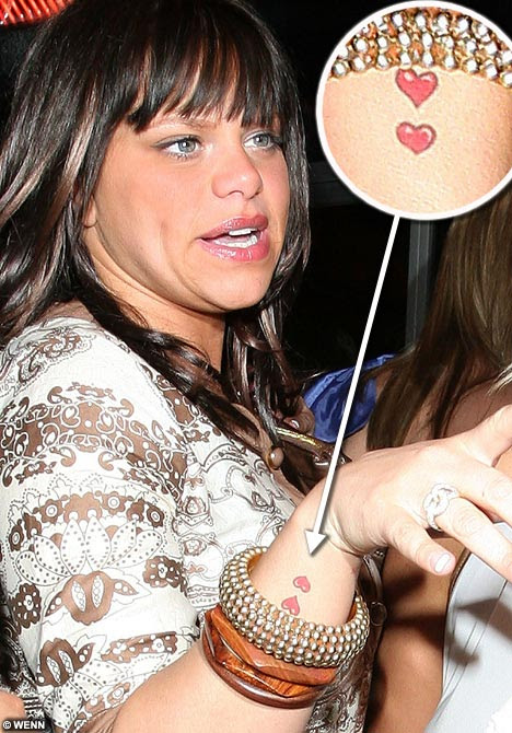 love and hearts tattoo. Love hearts: Jade shows off her new tattoo - but who are the hearts for?