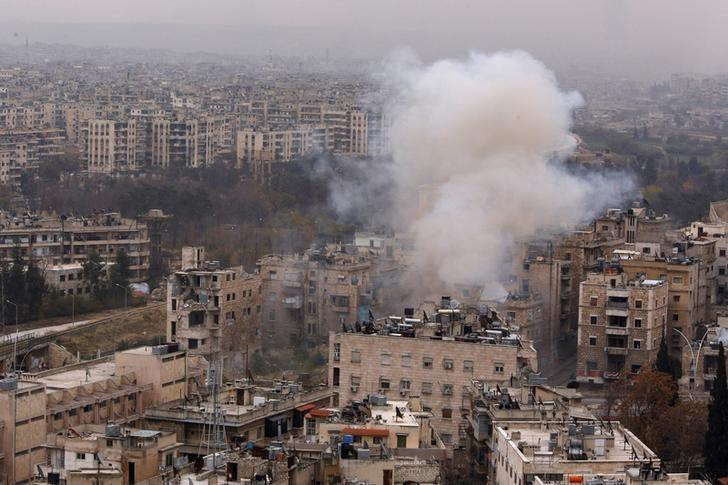 Smoke rises near Bustan al-Qasr crossing point in a government controlled area, during clashes with rebels in Aleppo, Syria December 5, 2016. REUTERS/Omar Sanadiki