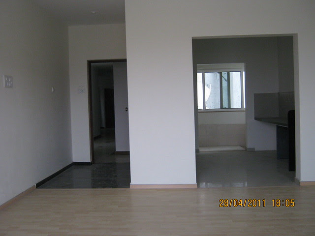 Entrance lobby and kitchen from the living cum dining of the flat in Sangria Towers, Megapolis Hinjewadi Phase 3
