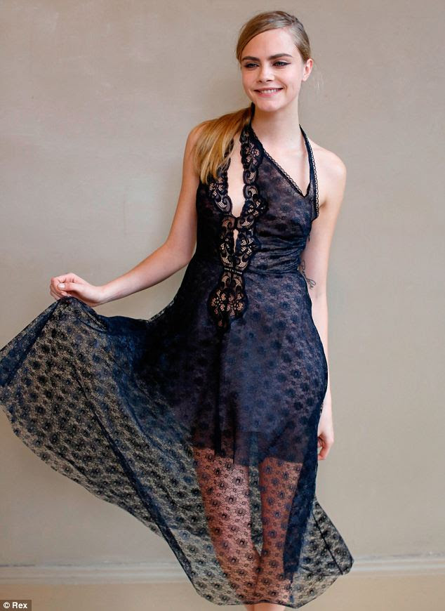 Loving her look: Cara Delevingne poses backstage at the Stella McCartney show, Paris Fashion Week