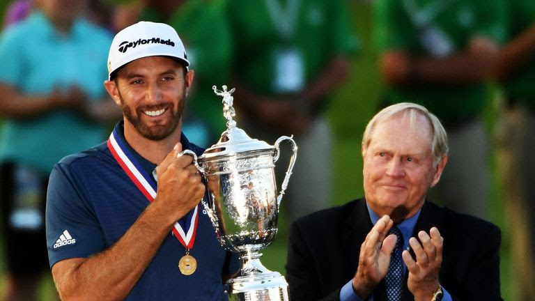 Johnson celebrates with the US Open trophy