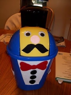 Photo of male side-Decorate one side of a small trash can (from Dollar Tree) to look like an old man, the other side to look like an old lady.  Children feed them magnetic letters, word cards, etc.  (Read 'Dr. Jean and Friends' Blog for more ideas.) 